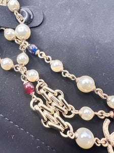 Chanel 17A limited edition long pearl necklace with links , and blue/red beads