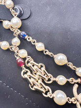 Chanel 17A limited edition long pearl necklace with links , and blue/red beads